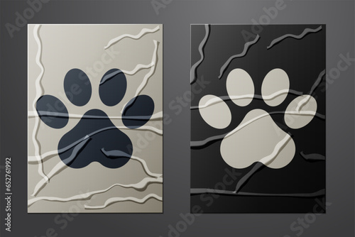 White Paw print icon isolated on crumpled paper background. Dog or cat paw print. Animal track. Paper art style. Vector