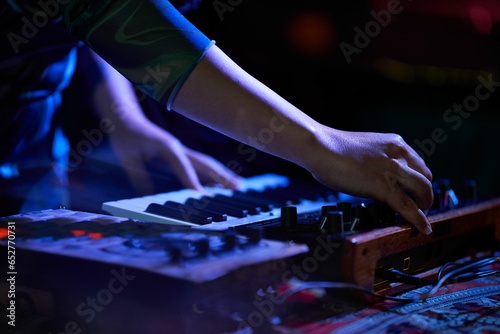 Closeup of a musician playing on a keyboard