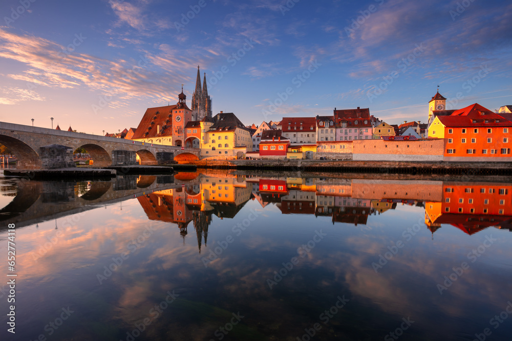 Regensburg, Germany. Cityscape image of Regensburg, Germany with Old Stone Bridge over Danube River and St. Peter Cathedral at autumn sunrise.