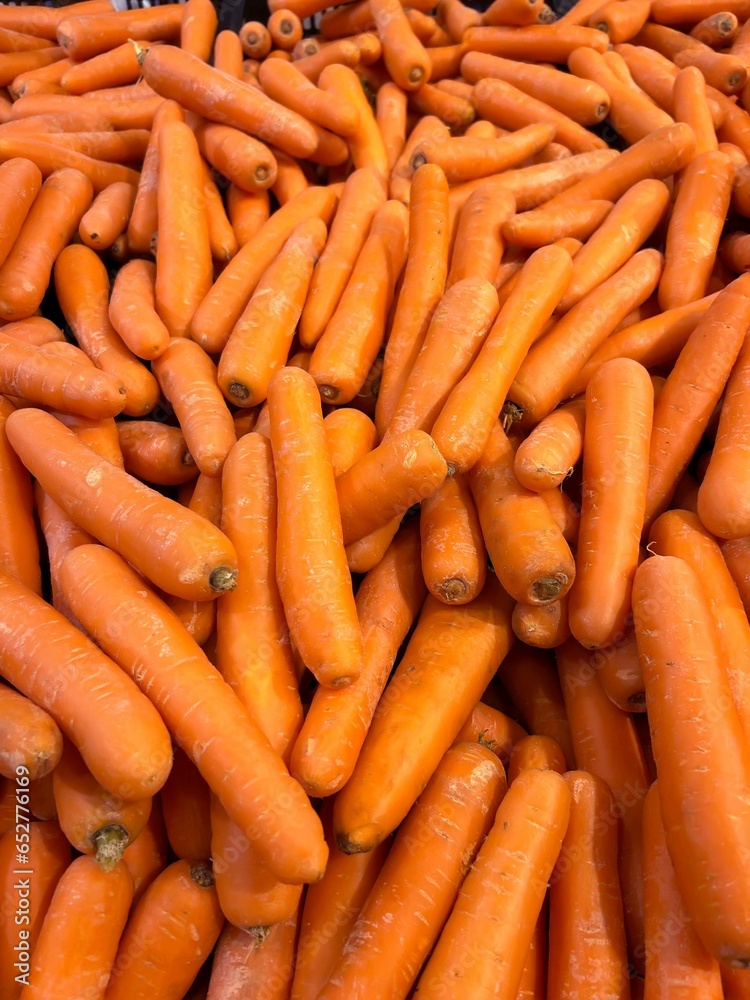 Heap of fresh orange carrots.