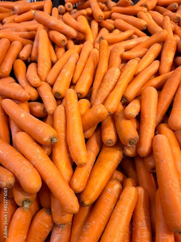 Heap of fresh orange carrots.