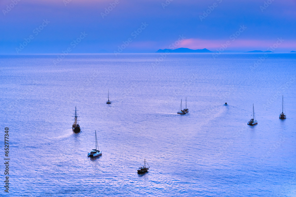Aerial view of sailboats and yachts in calm Mediterranean sea waters