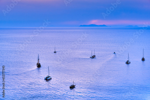 Obraz na płótnie Aerial view of sailboats and yachts in calm Mediterranean sea waters w salonie