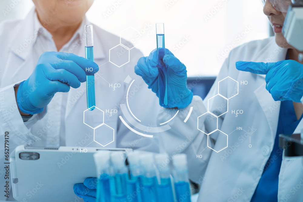 Scientist works with a pipette and a test tube. Scientific laboratory of biotechnology, development of medicine and research in chemistry, biochemistry and experiments. Scientist works with a pipette and a test tube. Scientific laboratory of biotechnology, development of medicine and research in chemistry, biochemistry and experiments.