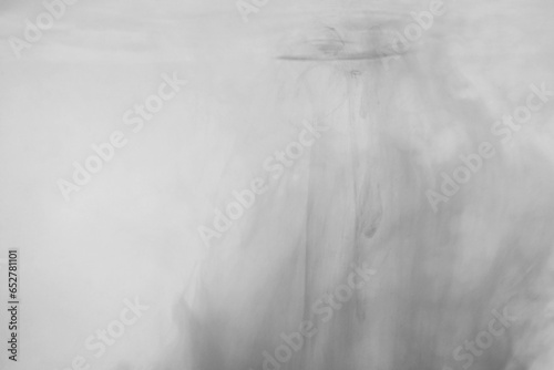 Black color dye melt in water on white background,Abstract smoke pattern,Colored liquid dye,Splash paint	