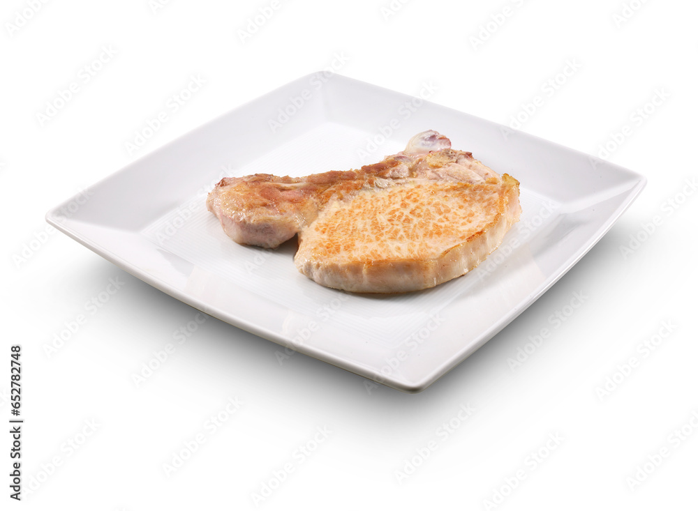Chuleta de cerdo ferrita sobre plato blanco. Ferrite pork chop on white plate.
