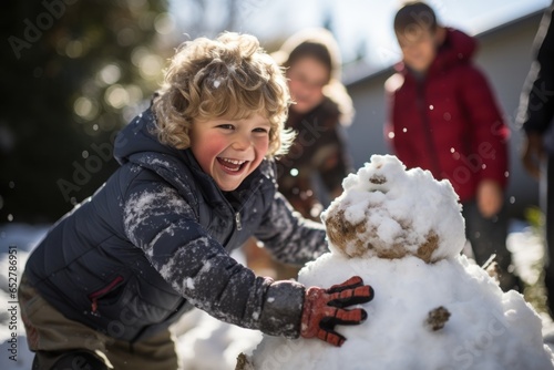 children playing with snow - creating a snowman