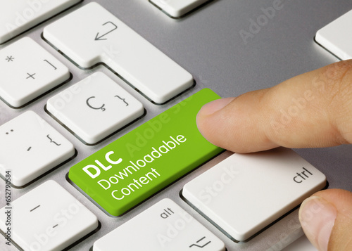 DLC Downloadable Content - Inscription on Green Keyboard Key.