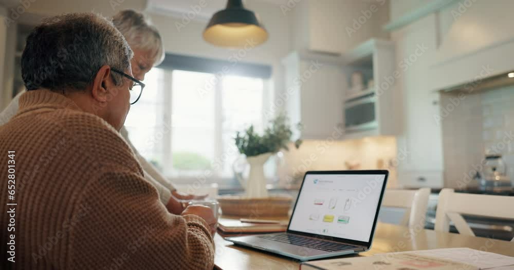 Senior, couple and coffee with laptop on kitchen table for online shopping, internet browsing and website search. Old people, tea and wireless mobile with technology, searching and talking at home