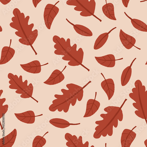 Vector seamless pattern with brown leaves on beige. Autumn nature pattern. Vector illustration