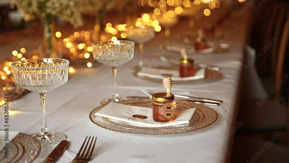elegant wedding table setting. The festive table is decorated with decorations and ice garlands and beautiful table settings.