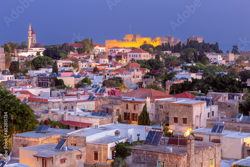 Stone towers and walls of old medieval fortifications on the island of Rhodes.