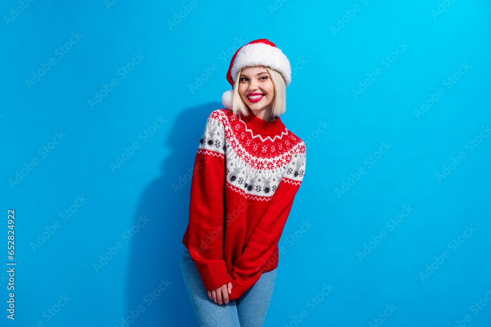 Photo of charming adorable woman lady santa elf wear ornament pullover celebrating x-mas isolated blue color background Photo of charming adorable woman lady santa elf wear ornament pullover celebrating x-mas isolated blue color background