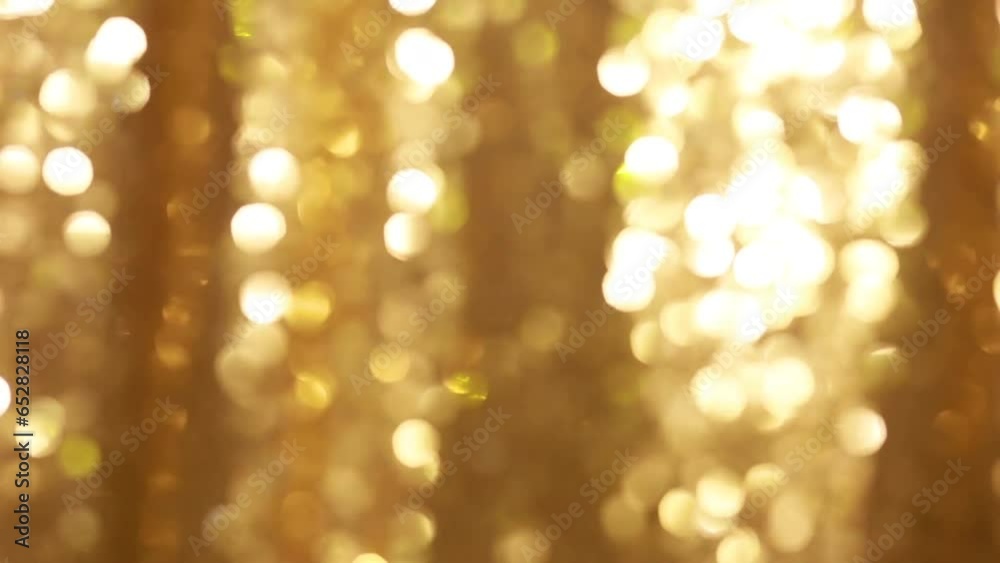 Animated golden abstract background with blurred bokeh lights. Animated golden abstract background with blurred bokeh lights.