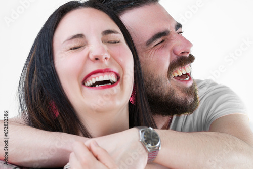 Couple embrace and laugh, isolated together photo