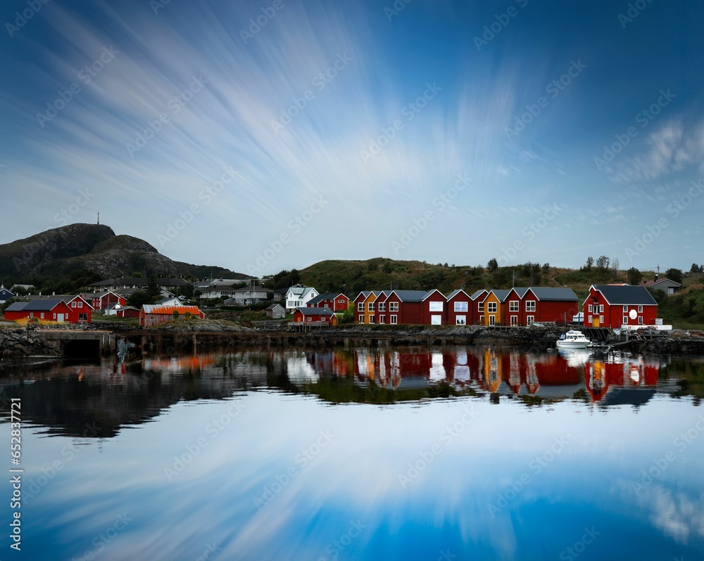 Stunning scene in the Lofoten Islands of Norway, showing traditional red-painted houses