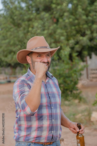 middle-aged man dressed as a cowboy with a victorious expression