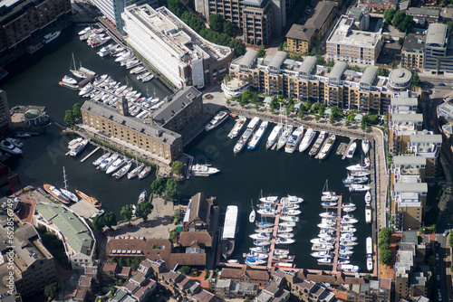 London St katherines Dock Aerial View Landmarks and Skyline on a Sunny Day English British United Kingdom Tourist tourism site Capital City Helicopter Drone photo