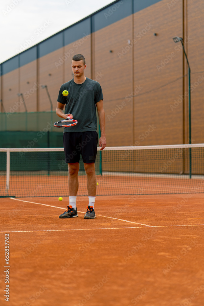 Obraz premium young tennis player coach hitting the ball with a racket on the tennis court preparing for the competition sports lifestyle