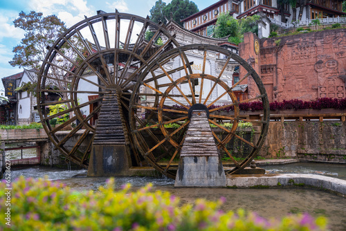 The water wheel in Old Town of Lijiang in Yunnan, China. It is part of UNESCO World Heritage Site - Old Town of Lijiang.