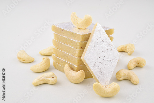 Kaju katli sweet on white background with cashew photo