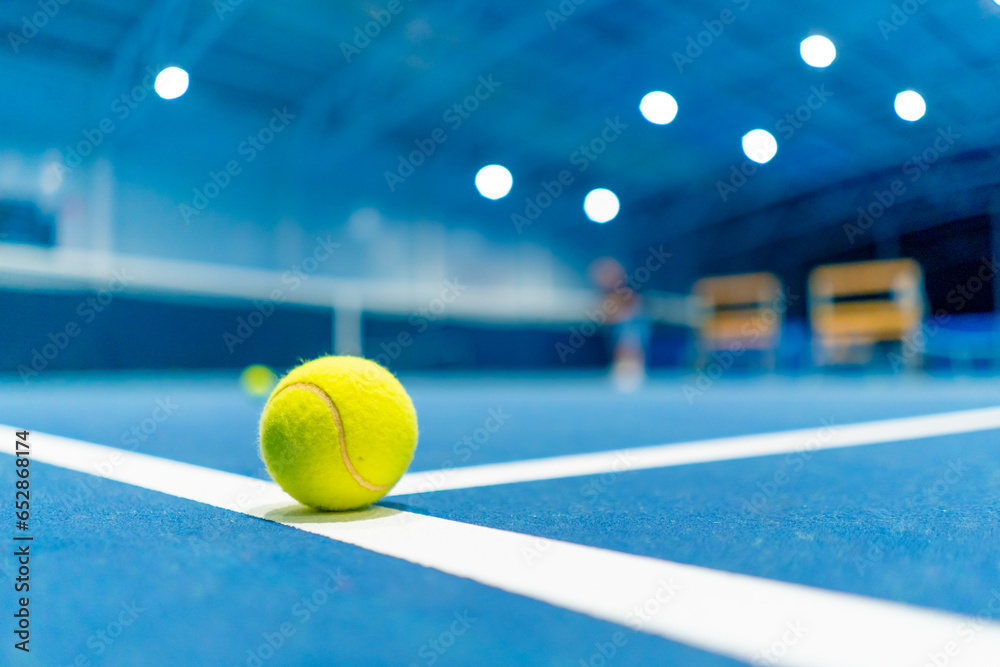 a small bright ball lies on the tennis court professional sport training hobby game - obrazy, fototapety, plakaty 