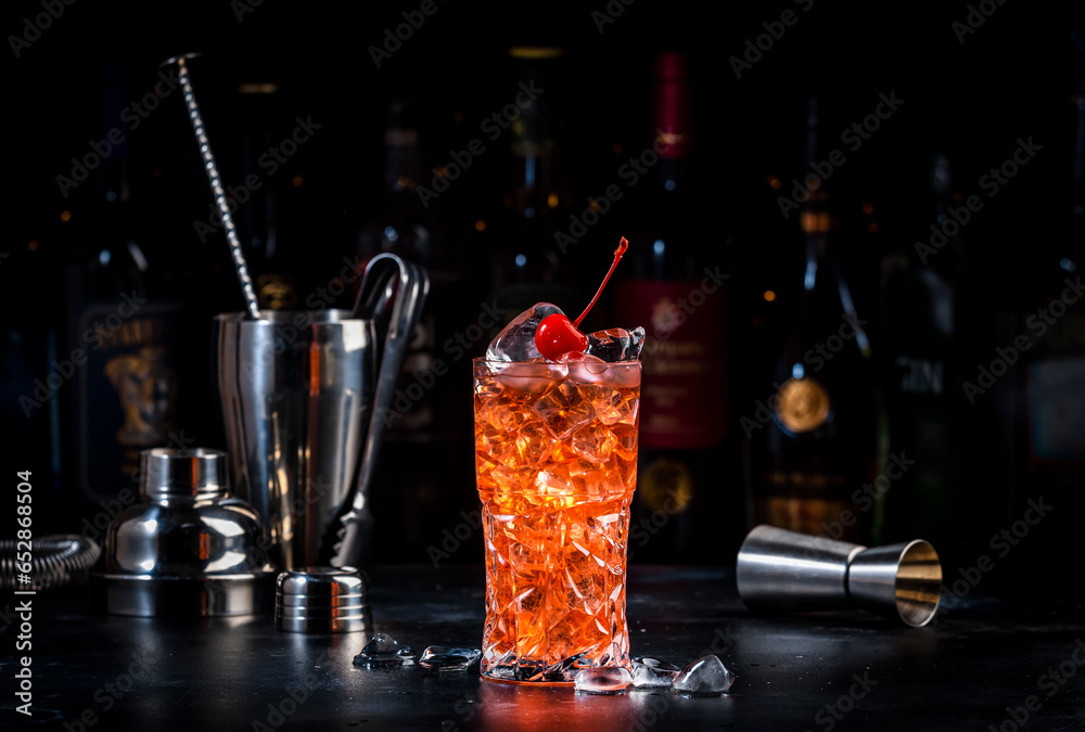 Rose with cherry, red cocktail drink with pink vermouth, amaretto