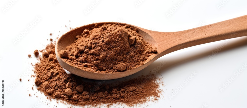 Isolated wooden spoon with coffee powder on white background Isolated wooden spoon with coffee powder on white background