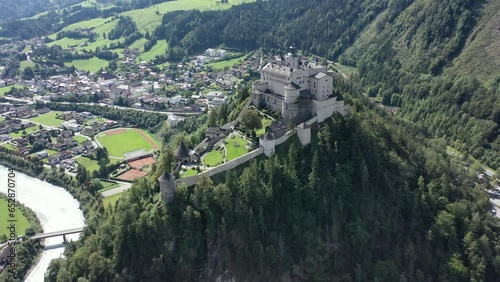 Hohenwerfen Fortress in the Pongau region of Salzburg. On the steep peak, high above the Salzach valley Austrian Alps, Austria, Europe. Medieval rock fortress. Aerial. Summer.