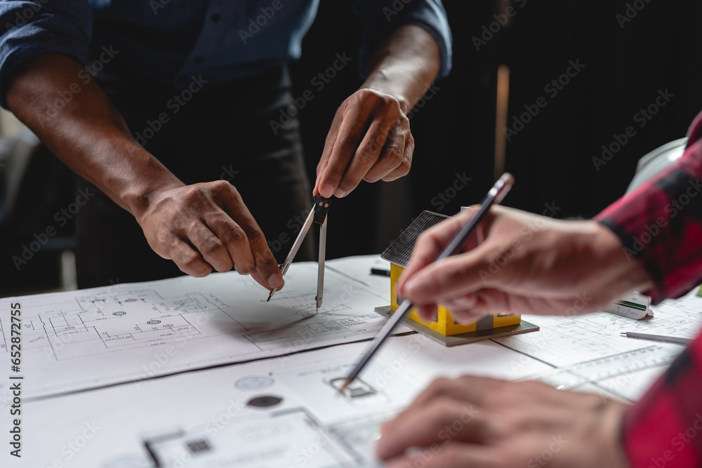 Creative engineering or architect Brainstorming on construction projects Engineer working with compasses in blueprint model in office house project idea real estate Creative engineering or architect Brainstorming on construction projects Engineer working with compasses in blueprint model in office house project idea real estate