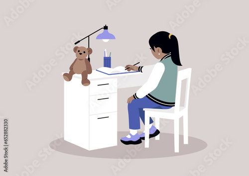 A young female preschool student diligently working on her homework at a desk with drawers, representing the concept of home education