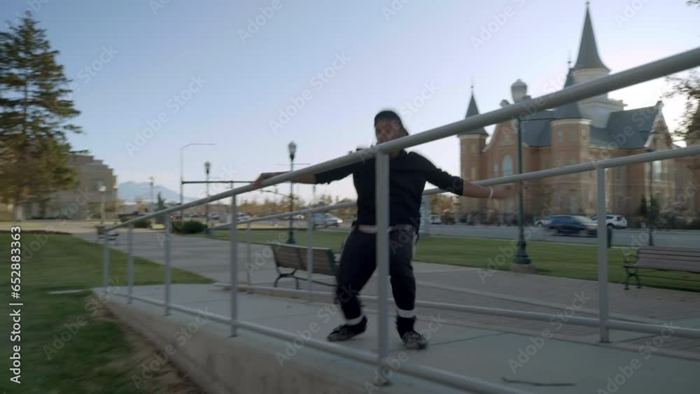 African american young man doing flips and parkour in rural area. African american young man doing flips and parkour in rural area.