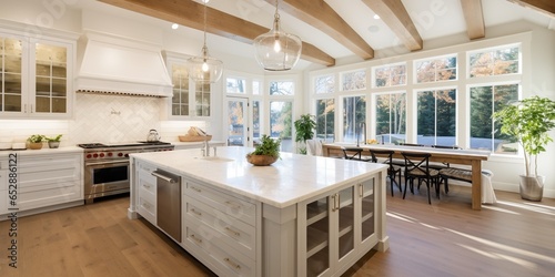 Kitchen interior in beautiful new luxury home with kitchen island and wooden floor, bright modern minimal style,  with copy space.