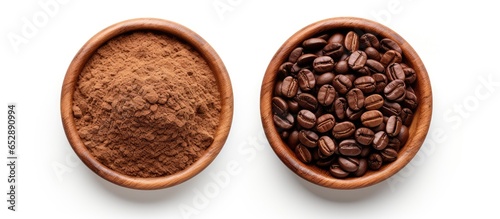 Isolated white background image of roasted coffee beans and ground coffee in a wooden bowl
