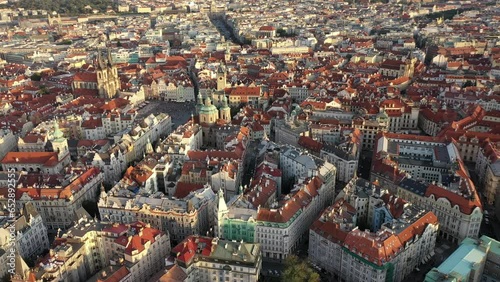 Sunny aerial drone view above Prague Old Town Square. Czech Republic. Summer. Sunset. Tourist town. City life.