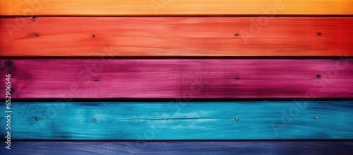 Image of vibrant wooden rainbow backdrop with room for text