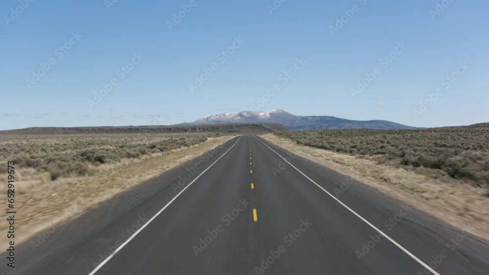 Driving down a highway, stabilized shot of country road. Driving down a highway, stabilized shot of country road.