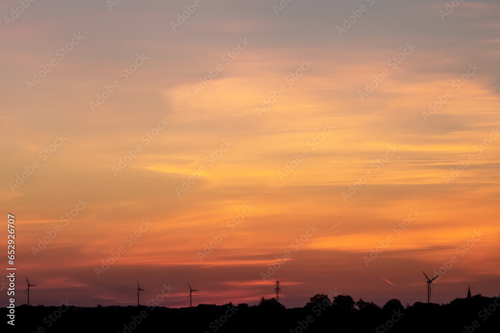Sunrise with beautiful cloudscape and landscape silhouette