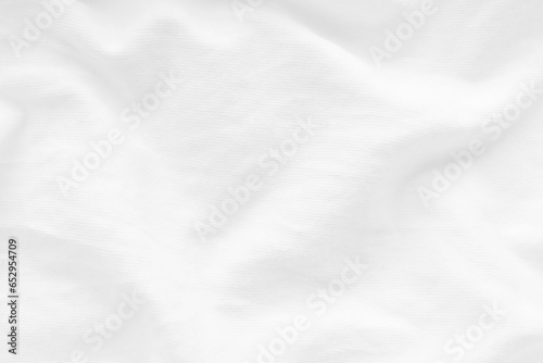 Wrinkled white cotton fabric clothes texture background.