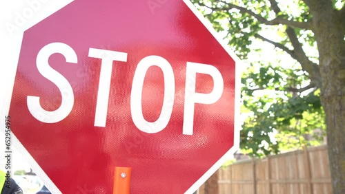 Traffic control with stop slow sign according to construction plan