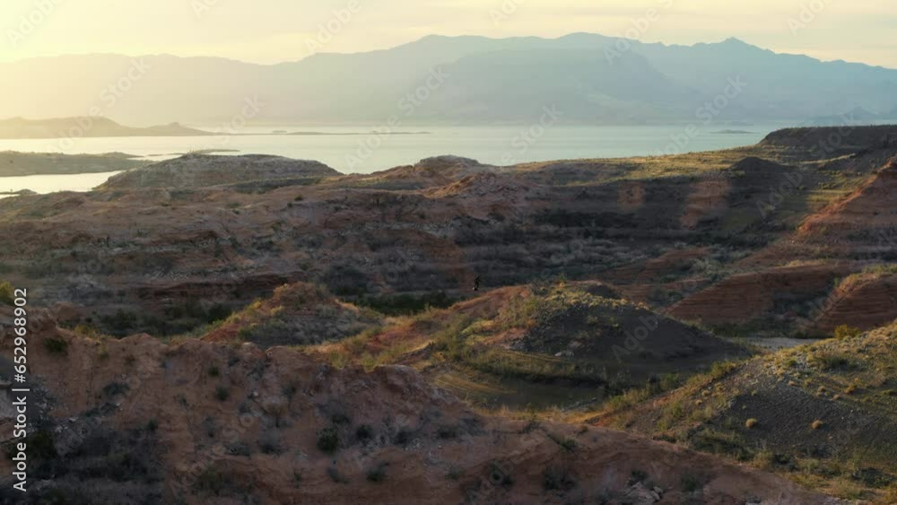 Flying Over Desert Hills Near Hoverboarder At Sunset Flying Over Desert Hills Near Hoverboarder At Sunset