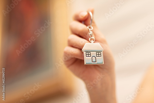 Woman Holding House Keys. Real estate concept