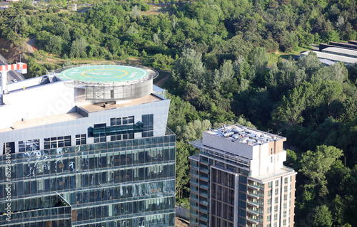 Aerial view of helipad. Helicopter landing pad on rooftop on skyscraper, high-rise office building in İstanbul Downtown, Turkey. Financial district and business centers in smart city in Turkey.