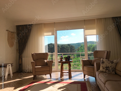 living room with beauitiful sunrise and mountain backdrop