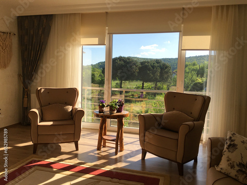 living room with beauitiful sunrise and mountain backdrop