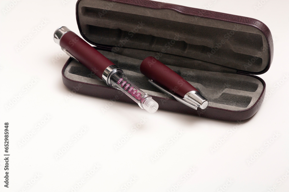 Insulin pen injector. Insulin pen fill with needle on white background. Diabetes Day. Insulin pen injector. Insulin pen fill with needle on white background. Diabetes Day.