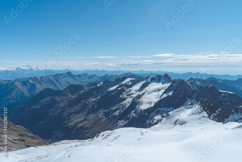 View from the summit of Gran Paradiso towards mountains and clouds
