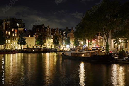 Majestic Amsterdam at night. Summer city landscape. Panorama