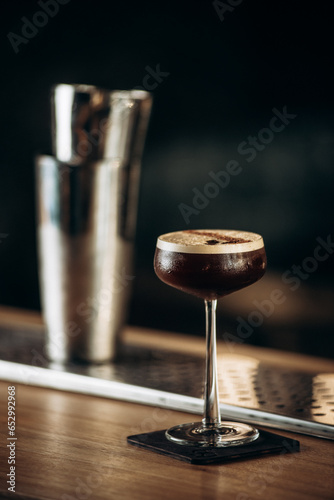 Espresso cocktail with coffee beans served on table