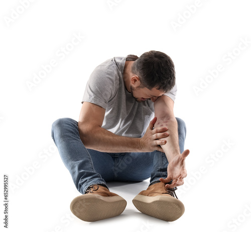 Male drug addict sitting on...
